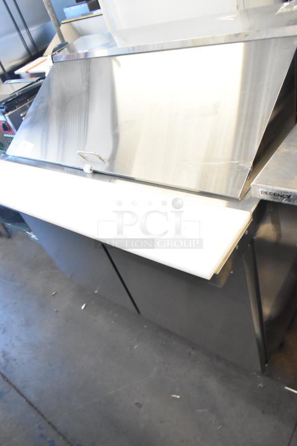 Brand new Avantco 178APT48MHG stainless steel sandwich prep table, scratch and dent, commercial casters, 115V.