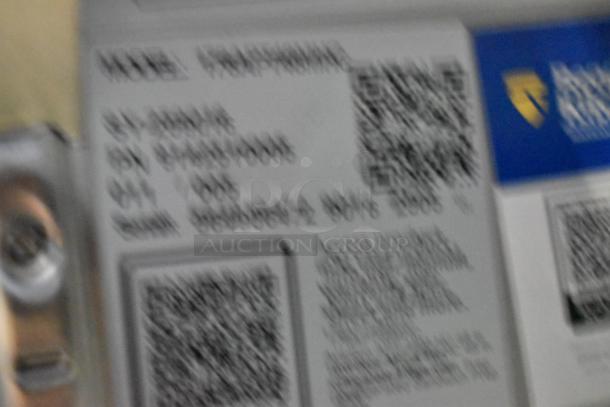 Blurry label on an Avantco 178APT48MHC stainless steel commercial sandwich prep table.