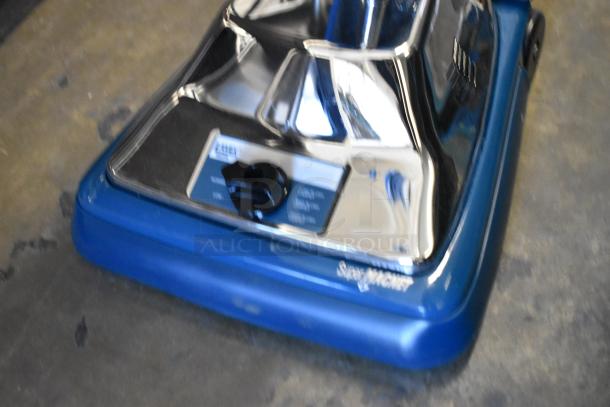BRAND NEW 457LAVHEPA12 Lavex 12" upright vacuum cleaner with HEPA filtration, blue base, visible SuperVac label. 120V, 1 phase.