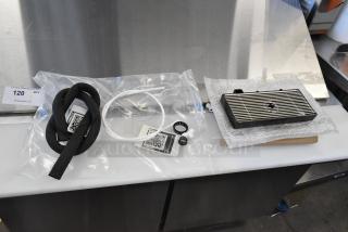 Brand new scratch and dent drip tray with protective packaging. Includes installation accessories in labeled bags.