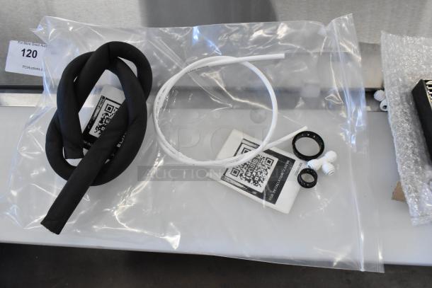 Brand new scratch and dent drip tray with installation kit. Includes hoses, gaskets, and QR code instruction card, sealed in plastic.