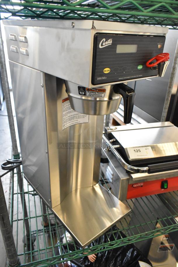 BRAND NEW Curtis D500GT12A000 stainless steel airpot coffee brewer with digital controls, 120V, 1 phase, minor scratches.