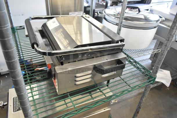 Brand new Avantco 177PG200GS stainless steel Panini grill, grooved top, smooth bottom, 13 3/8"x8 3/4", 120V, scratch and dent.