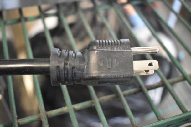 Close-up of a power plug for the 2023 Avantco 177PG200GS commercial panini grill. Plug shown on a rack.