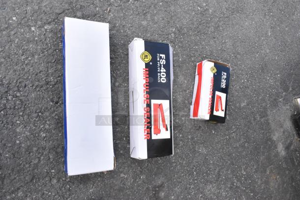 Three brand new Galaxy Impulse Heat Bag Sealers in original packaging, 110V, 1 Phase, FS-400 and FS-200 models.