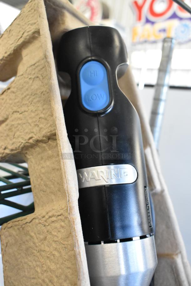 Waring WSB35 Quick Stik immersion blender, brand new, featuring "HI" and "LOW" speed settings, black and silver design.