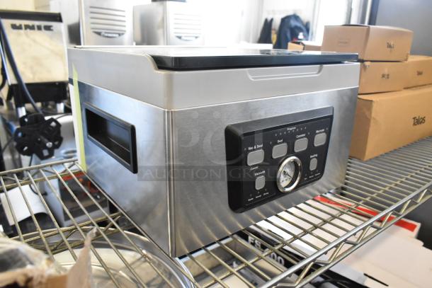 Galaxy 177GVMC10P Chamber Vacuum Packing Machine, stainless steel, new condition, control panel, stored on metal rack.