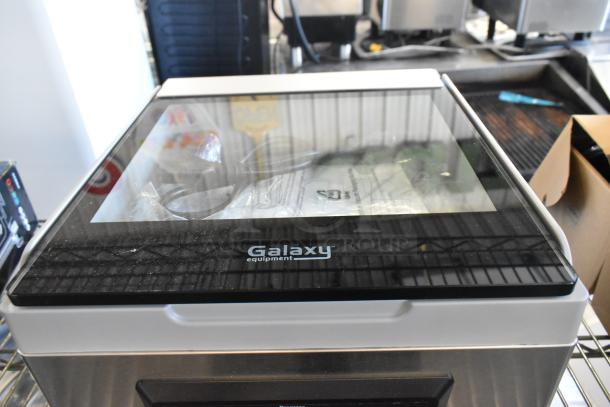 Brand new Galaxy 177GVMC10P Chamber Vacuum Packing Machine, scratch and dent condition, visible branding on lid.