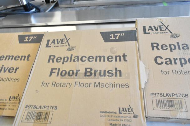 Three new Lavex floor care items in boxes: 978LAVP17PD pad driver, 978LAVP17FB nylon brush, 978LAVP17CB carpet brush.
