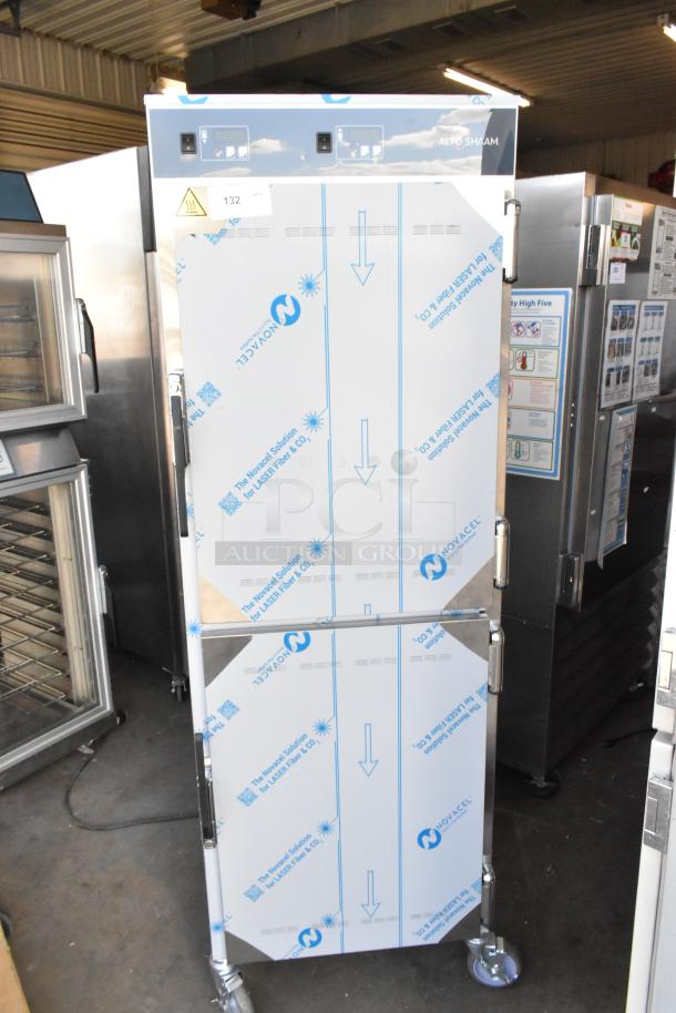 Brand new Alto Shaam stainless steel heated holding cabinet with two half-size doors, on commercial casters, minor scratches.