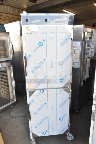 Brand new Alto Shaam stainless steel heated holding cabinet with two half-size doors, on commercial casters, minor scratches.