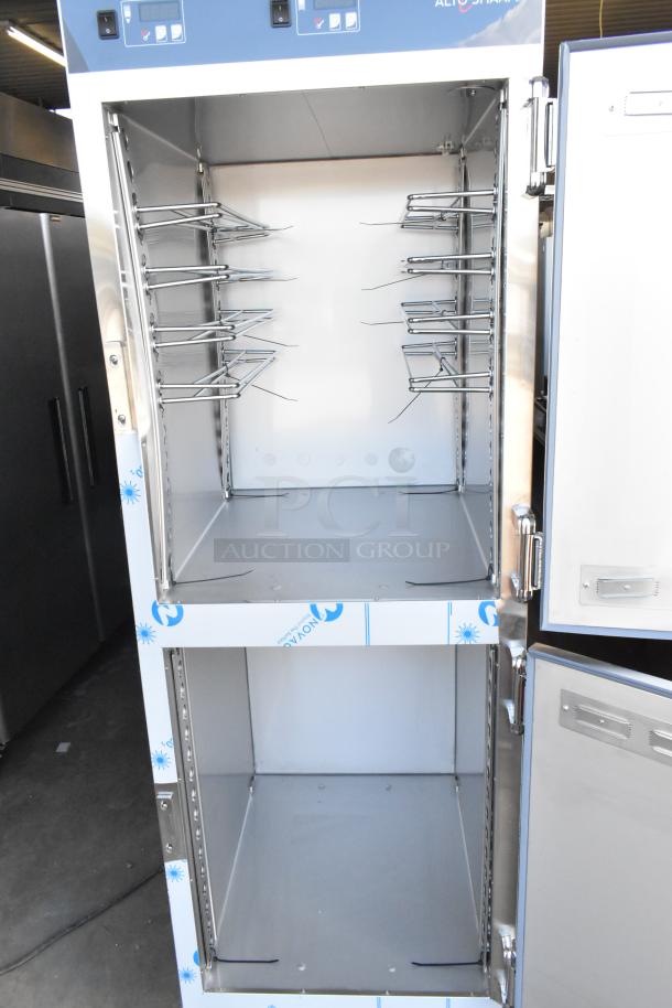 Alto Shaam stainless steel heated holding cabinet, brand new, with minor scratches, dual half-size doors, commercial casters.