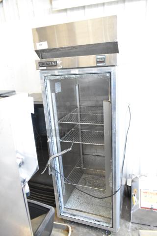 Hobart Q1 Stainless Steel Commercial Single Door Reach In Cooler on Commercial Casters. See Pictures for Broken Glass. 115 Volts, 1 Phase. - Item #1214106