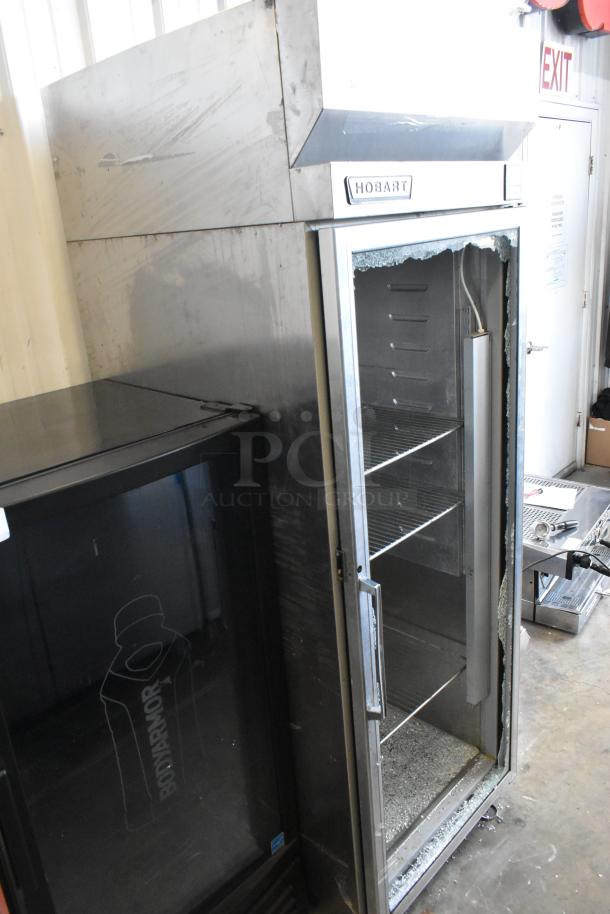 Hobart Q1 stainless steel commercial reach-in cooler, single door on casters, broken glass visible, 115V, 1 phase.