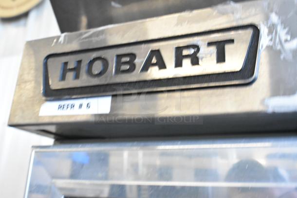 Hobart Q1 stainless steel cooler with single door, broken glass visible. On commercial casters, 115V, 1 phase.