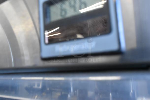 Hobart Q1 stainless steel commercial reach-in cooler showing temperature display. Note damaged glass. 115V, 1 phase.