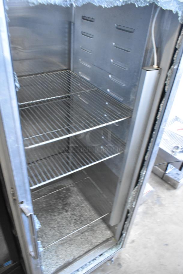 Hobart Q1 stainless steel reach-in cooler on casters, single door, visible broken glass, 115 volts, 1 phase.