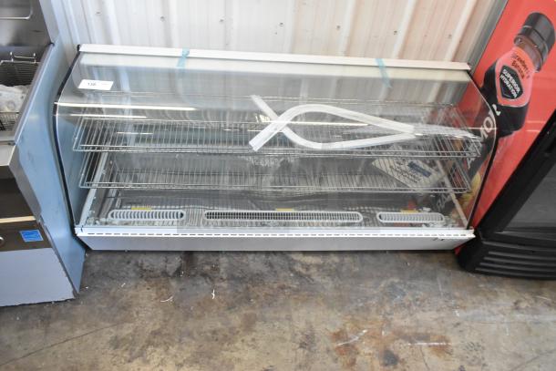Brand new Avantco metal countertop display case with scratch and dent damage. Missing side panels visible.