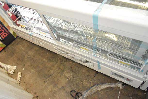 Brand new Avantco metal countertop display case with scratches, dents, and missing side panels. Clear shelves visible.
