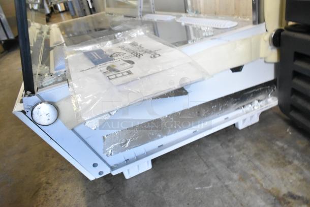 Avantco Metal Countertop Display Case, brand new with scratches and dents, missing two side panels, visible on the side.