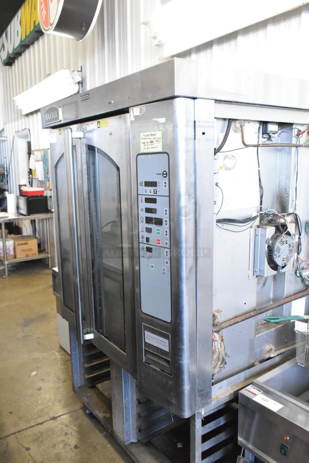 Baxter stainless steel commercial natural gas mini rotating rack oven, featuring double pan rack, on commercial casters.