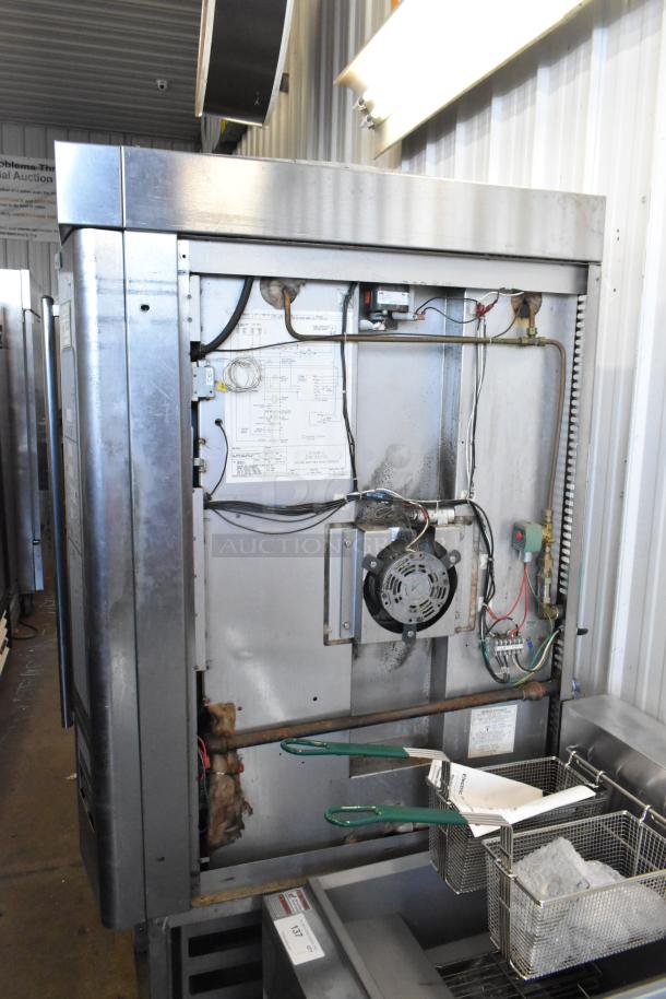 Baxter stainless steel commercial mini rotating rack oven, natural gas powered, on double pan rack with commercial casters.