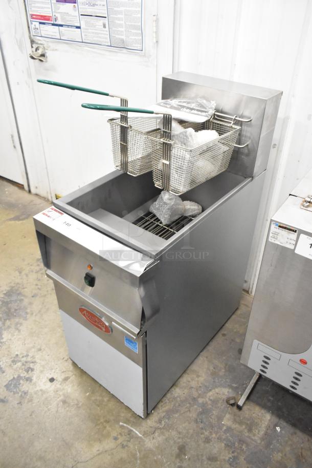 Brand new Avantco 177EF40D stainless steel commercial deep fryer with two metal baskets, 240V, 1-phase, minor scratches.