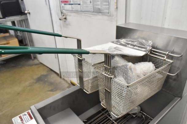 BRAND NEW 2024 Avantco 177EF40D stainless steel electric fryer with two metal baskets, 240V, 1 Phase. Some scratches and dents.