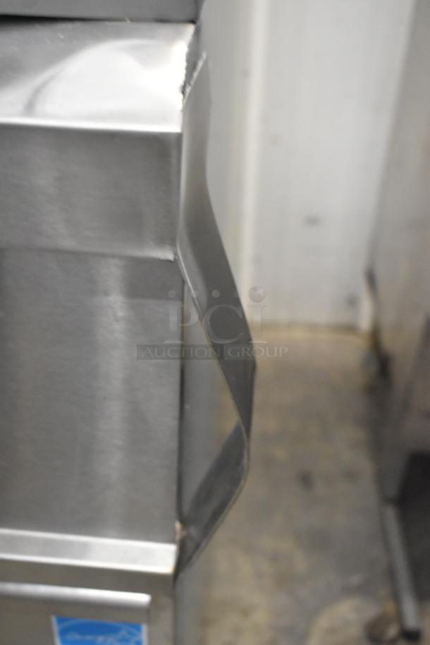 Avantco 177EF40D stainless steel fryer, new scratch and dent, shows side dent. Includes 2 metal fry baskets. 240V, 1 phase.