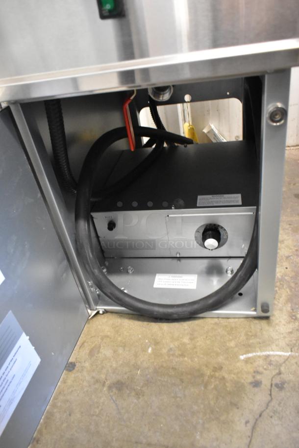 Brand new Avantco 177EF40D stainless steel electric fryer with two baskets, 240V, 1 phase, internal view showing wiring.