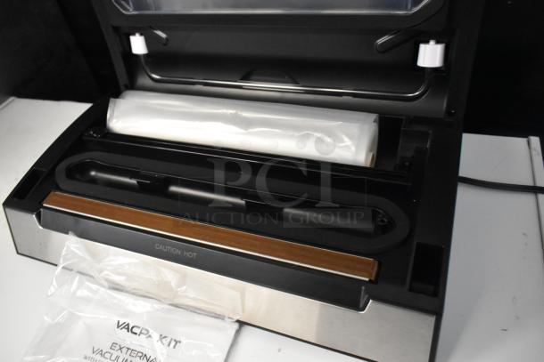 VacPak-It 186VSM12PRO vacuum sealer with 12" seal bar, cutter, roll holder; 120V, 1 phase; tag reads "Caution: Hot".