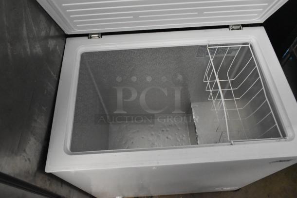 Arctic King ARC070S0ARWW metal chest freezer, hinge lid open, spacious interior, 115 volts, excellent condition.