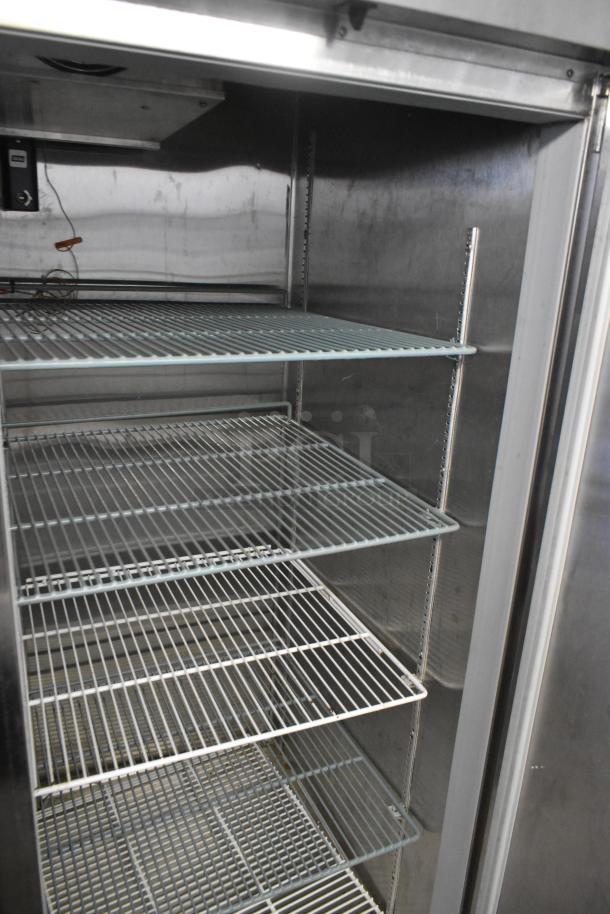 Beverage Air HBF49-1 stainless steel two-door reach-in freezer with poly-coated racks, on commercial casters, 115V.
