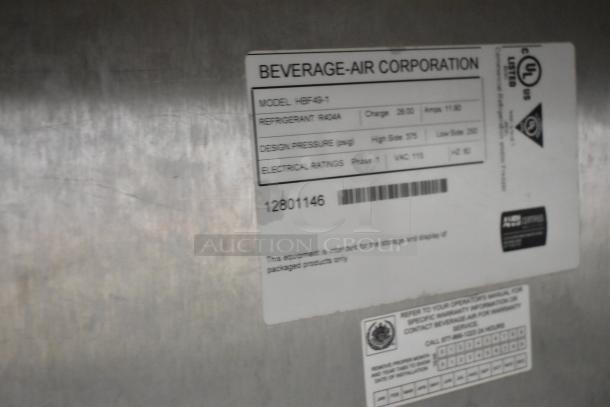 Beverage Air HBF49-1 stainless steel commercial freezer, 2 doors, poly coated racks, on casters, 115V, model tag visible.