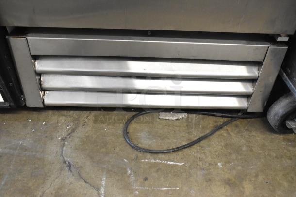 2016 True T-19F stainless steel commercial freezer. Single door, poly coated racks, visible wear. 115 volts, 1 phase.