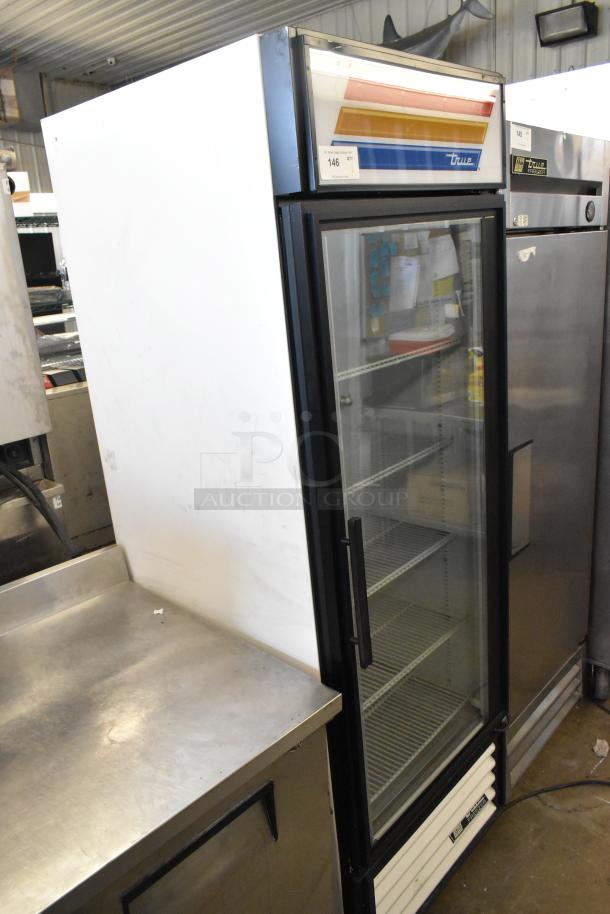 True GDM-23F commercial freezer with single glass door, metal exterior, poly coated racks. 115 volts, 1 phase.