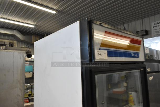True GDM-23F commercial single door reach-in freezer with metal exterior and poly coated racks, 115V, 1 Phase.