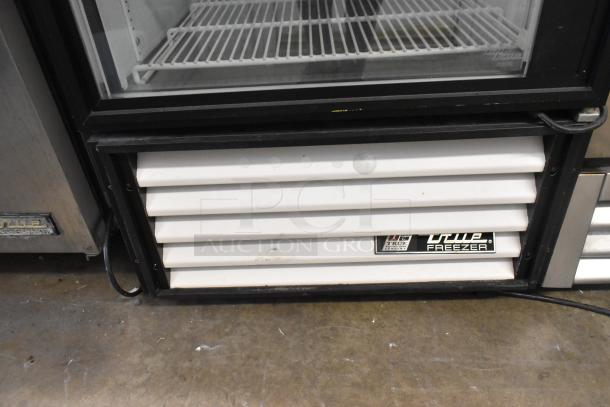 True GDM-23F commercial freezer with poly-coated racks, single door, 115 volts, 1 phase. Visible True branding on the front.