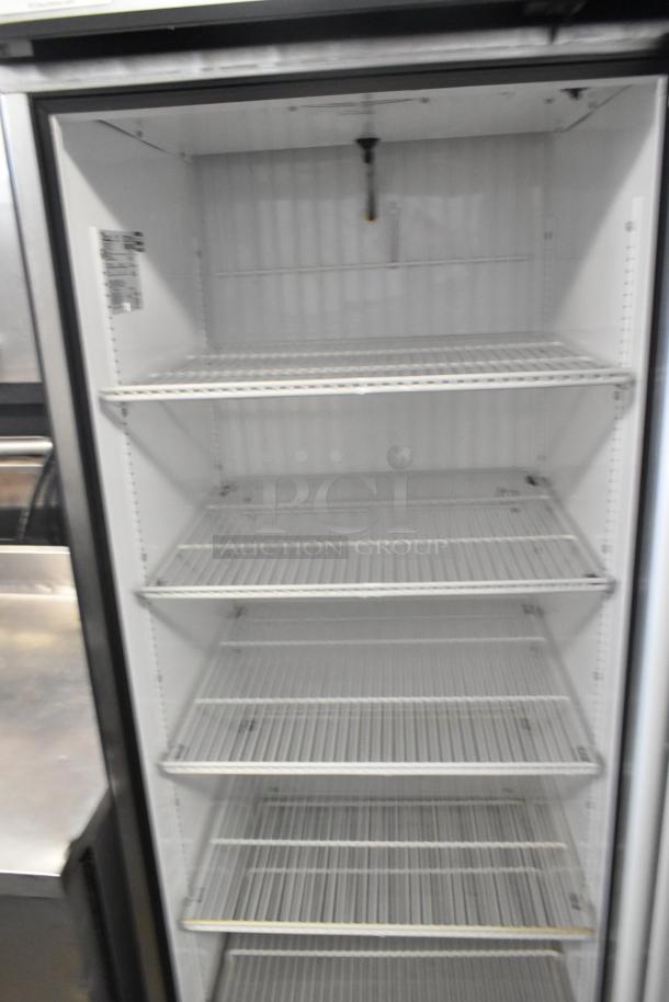 True GDM-23F commercial freezer, single door, metal build, poly coated racks, 115V, 1 phase, slightly worn condition.