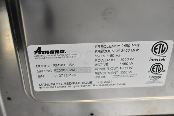 IN ORIGINAL BOX! Amana RMS10DSA commercial microwave, stainless steel, 120V, 1 phase. Label shows model and power specs.