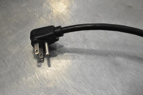Black power cord for Amana RMS10DSA microwave, showing three-prong plug, suitable for 120 volts, 1 phase.