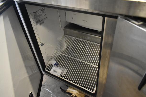 True TWT-72 stainless steel undercounter cooler, 3 doors, commercial casters, visible shelving, tag details model info.