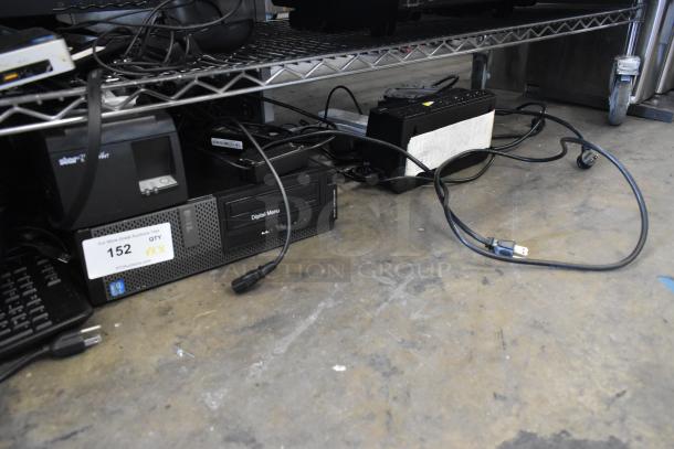 Lot of electronics including Star TSP100 receipt printer, four keyboards, a computer tower, and APC uninterruptible power supply.