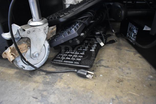 Lot of Star TSP100 receipt printer, 4 keyboards, computer tower, APC UPS, showing cable and wheel details, used condition.