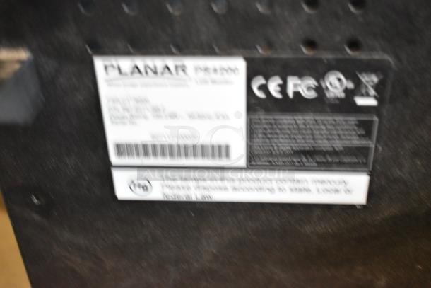Blurred label on the back of a Planar television, showing product specifications and compliance icons. Item requires dismantling.