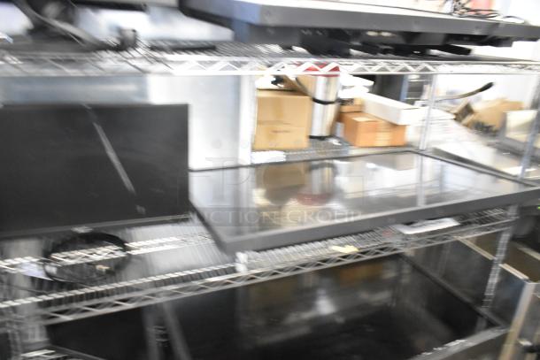 Four computer monitors including Lenovo, Dell, and Acer models on shelves. Buyer pickup required; no shipping.