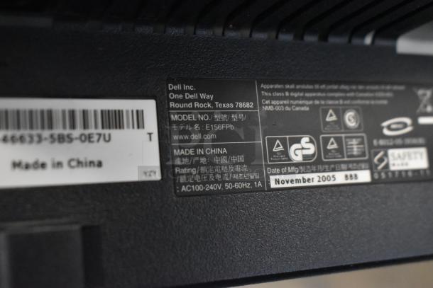 Close-up of Dell monitor label showing model E156FPb, made in China, manufactured November 2005.