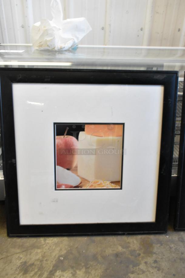 Framed picture featuring a block of cheese with an apple. Black frame, white matting. Minimal wear.