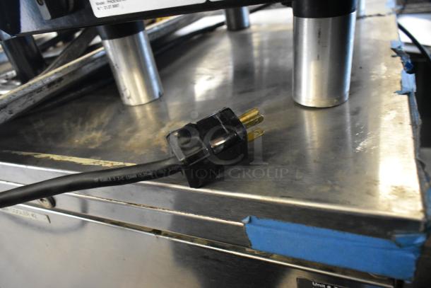 Unic Phoenix-MI stainless steel espresso machine, 110V, single group, visible power cord, minor wear, ideal for commercial use.
