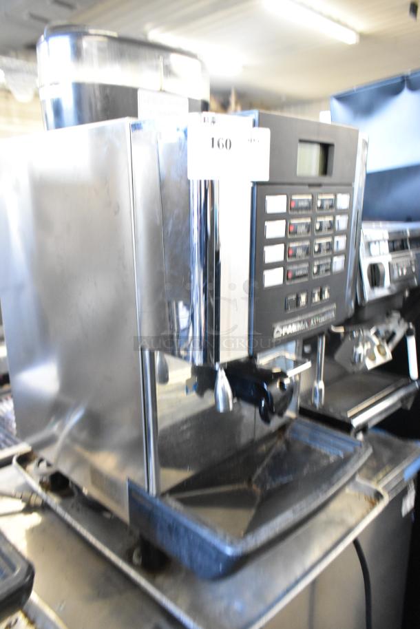 Faema stainless steel commercial espresso machine with steam wand, automatic controls, good condition, countertop design.